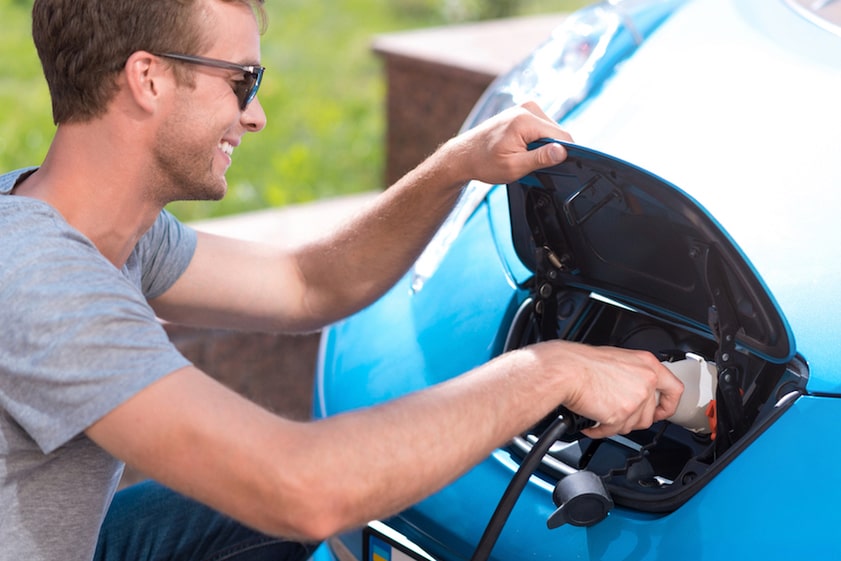 Plugging in an EV charger